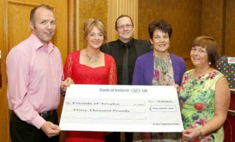 Parents and Staff get the cheque to support the project